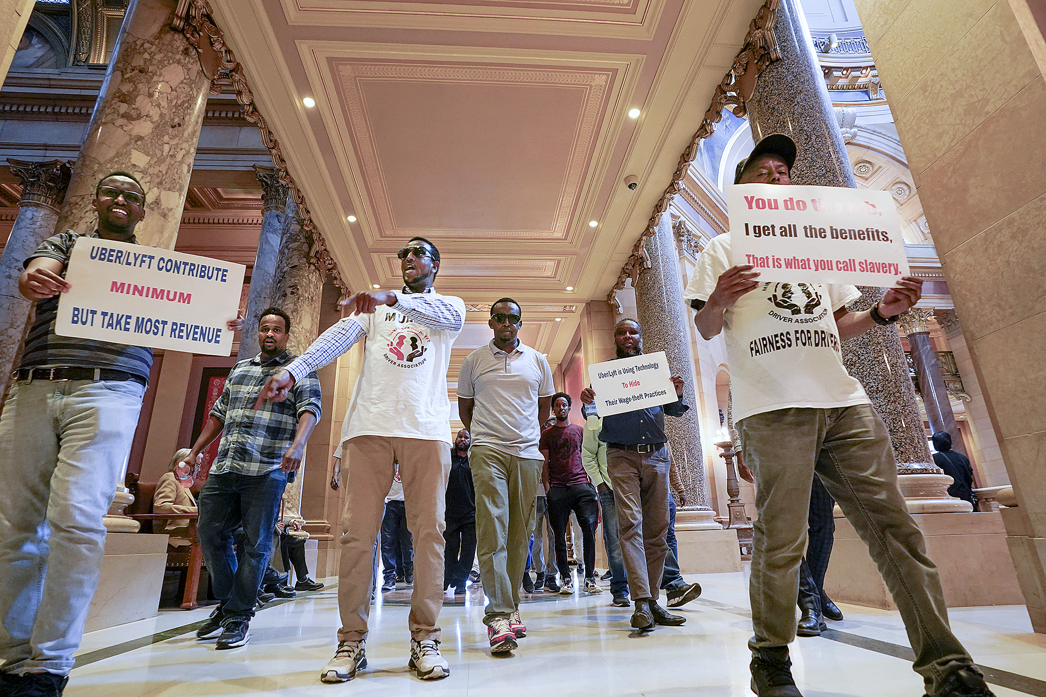 Rideshare drivers rally at the Capitol May 18. The House passed legislation Sunday that would set minimum pay for Uber and Lyft drivers and that the companies said would keep them operating in Minnesota. (Photo by Michele Jokinen) 